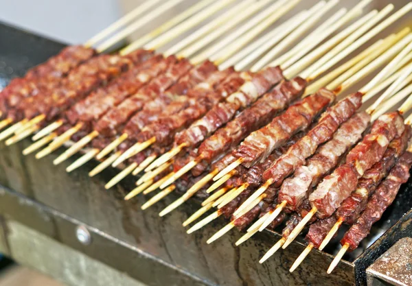 Kebabs of lamb and veal cooked grilled on the spit — Stock Photo, Image