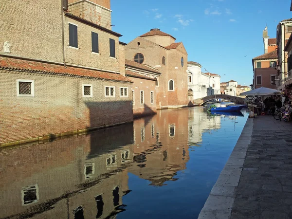 Reflections of the medieval church in the Canal in Chioggia — Stock Photo, Image
