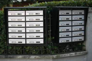 Mailboxes for mail delivery in a condominium clipart