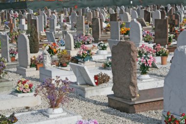 Graves headstones and crucifixes of a cemetery clipart