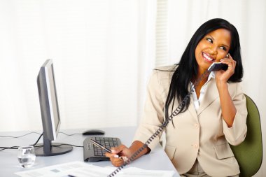 Happy executive talking on phone clipart