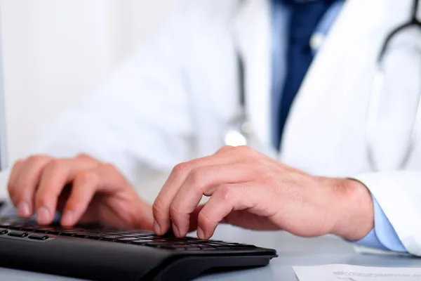 stock image Doctor hands using a computer