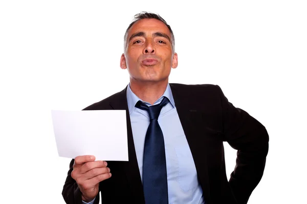 Friendly senior businessman showing a while card — Stock Photo, Image