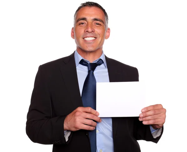 Attractive man smiling and showing a while card — Stock Photo, Image