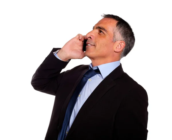 Hispanic professional man conversing with a mobile — Stock Photo, Image