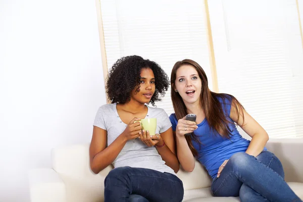 Cute girls watching TV — Stock Photo, Image