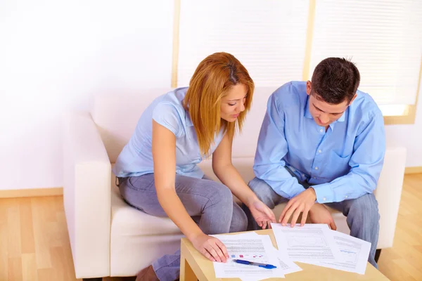 Stock image Couple reading documents