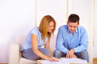 Couple reading documents clipart