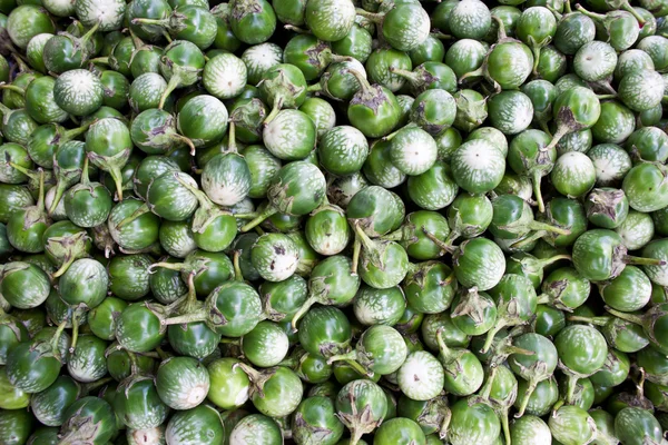 Little green Kermit eggplants raw background — Stock Photo, Image