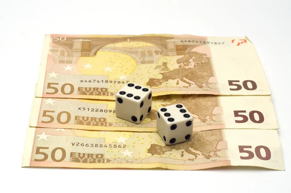 Dices and money, focused on dices — Stock Photo, Image