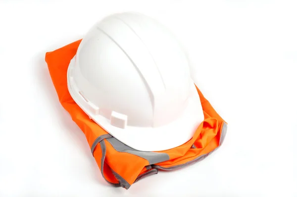 安全设备、 橙色背心 andhard 帽子。在白色隔离 免版税图库图片