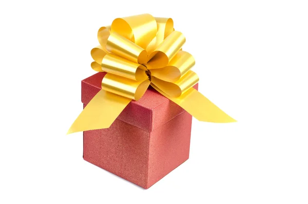 Red present box with yellow decoration — Stock Photo, Image