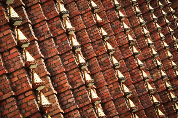 Brick wall with metal decoration — Stock Photo, Image