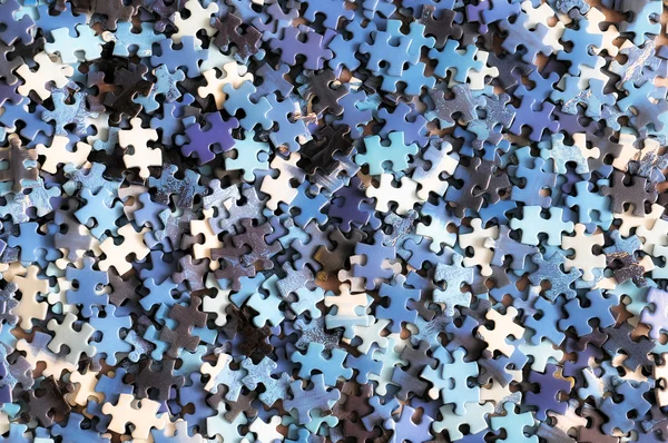 Pile of unfinished puzzle — Stock Photo, Image