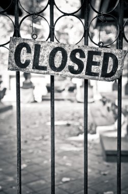 Closed sign on metal doors clipart