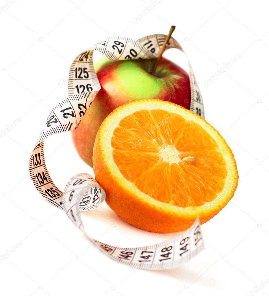 Orange half apple and measure tape