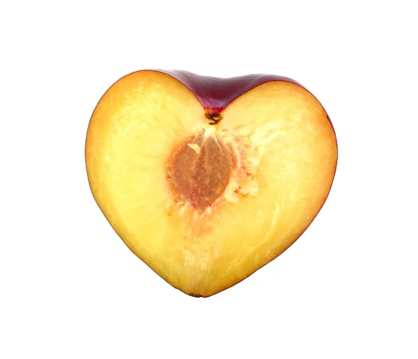 Half of plum shaped like heart — Stock Photo, Image
