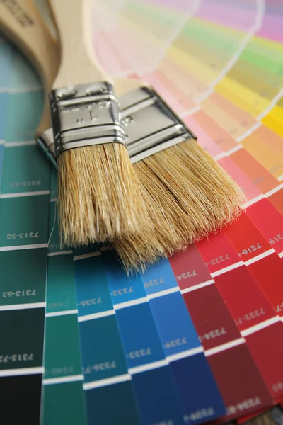 Brushes on a color palette — Stock Photo, Image
