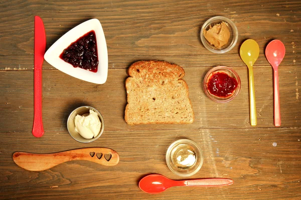 Toast and jam on table — Stock Photo, Image