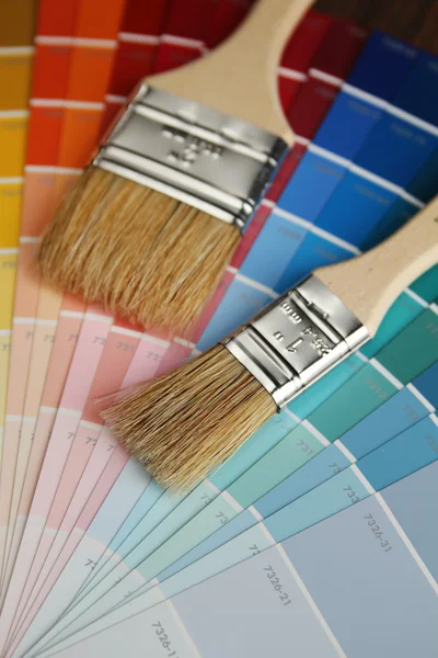 Brushes on color palette — Stock Photo, Image