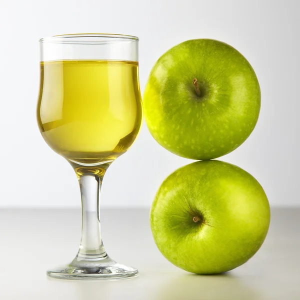 Stock image Glass of apple juice isolated on white