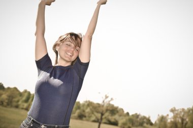 Woman enjoying life outdoors clipart