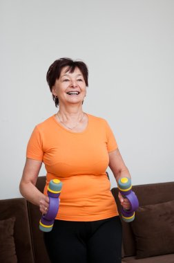 Woman exercising with barbells clipart