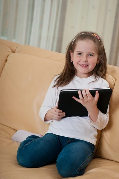 Girl playing with tablet — Stock Photo, Image