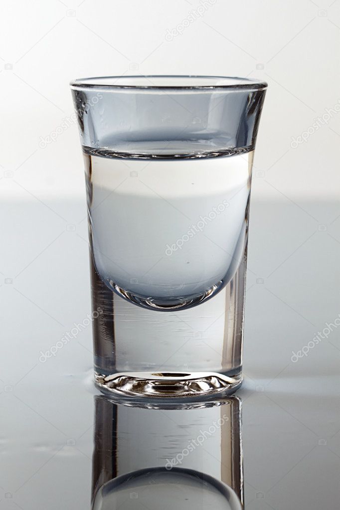 a glass of vodka stock photo c olegsam 10656638 a glass of vodka stock photo c olegsam 10656638