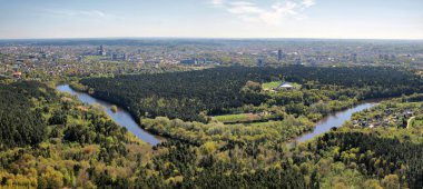 Vilnius city and nature with forests and river clipart