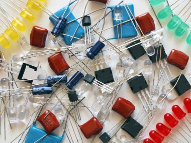 Background with components of electronics - LED, transistors, etc. clipart