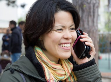 Woman calling with his mobile phone clipart