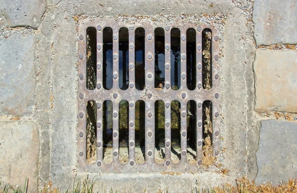 Small sewer grate — Stock Photo, Image