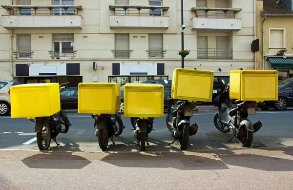 stock image Several pizza delivery mopeds