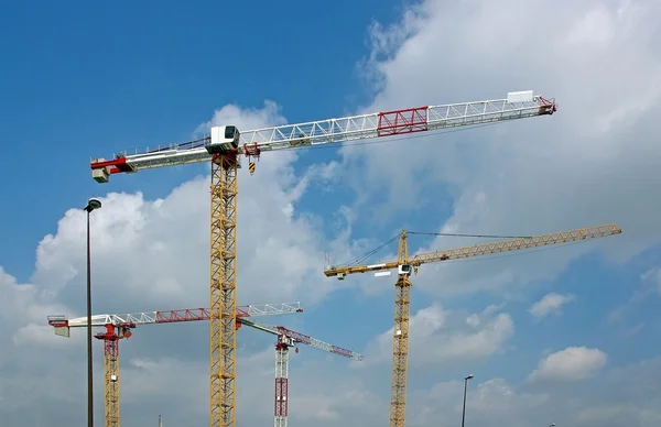 Four cranes on a construction site — Stock Photo, Image