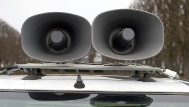Loudspeakers on car clipart