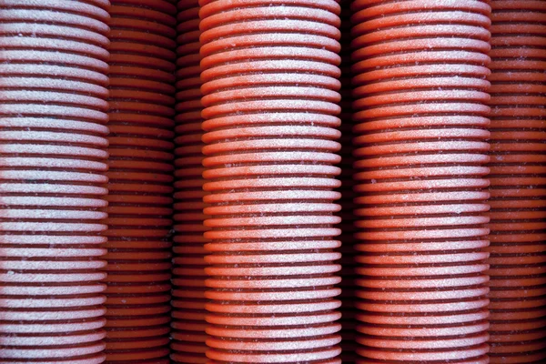 Tubos de plástico vermelho — Fotografia de Stock