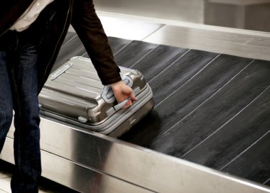 Suitcase on conveyor belt