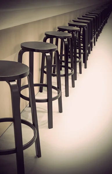Bar stools in a row — Stock Photo, Image