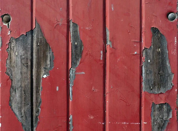 Wand mit abblätternder roter Farbe — Stockfoto