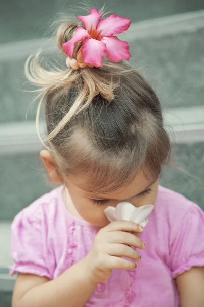 stock image Girl smelling a flower