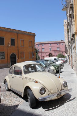Car parked in the historic part of city.Sardinia, Cagliari. clipart