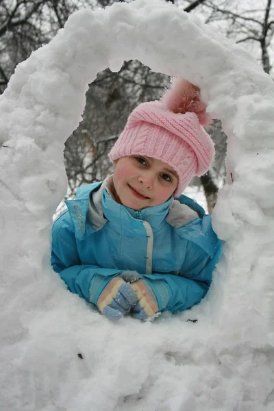 stock image Little girl in winter pink hat in snow