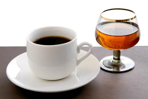 Чашка кофе и бренди — стоковое фото