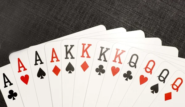 Playing cards on a black background — Stock Photo, Image