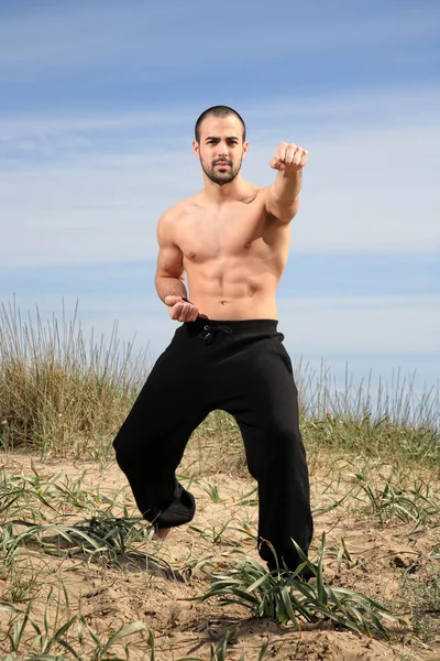 Young male fighter exercise outdoor — Stock Photo, Image