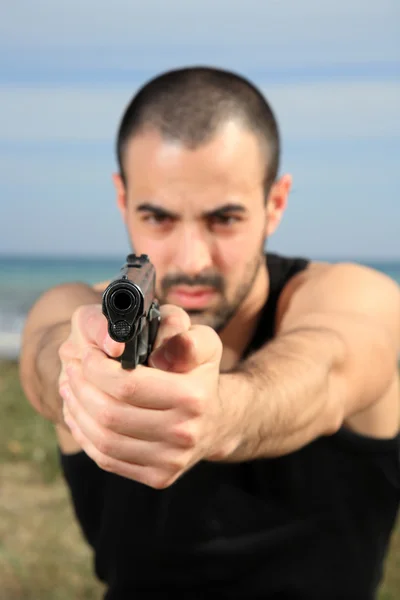 stock image Male bodyguard with a gun