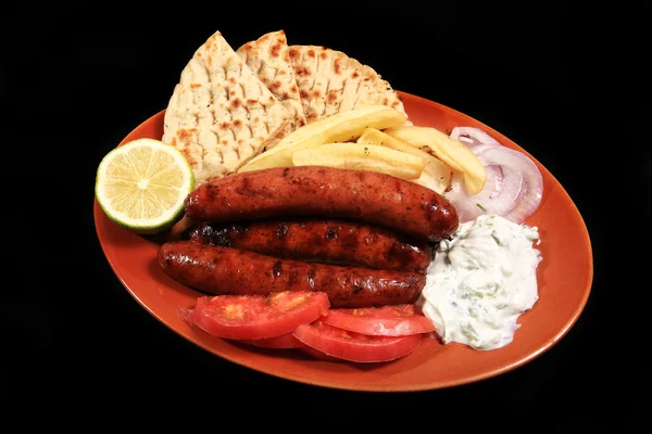 Sausages served on a plate — Stok fotoğraf