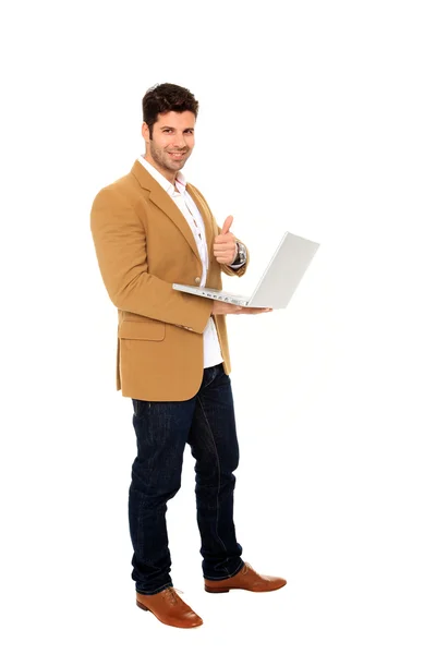 Empresario sosteniendo un portátil — Foto de Stock