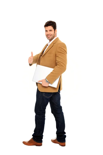 Biznesmen trzyma laptopa i kciuka — Zdjęcie stockowe